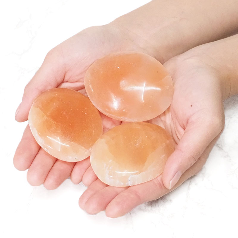 Orange Selenite Oval Palm Stones Set 3 5 Orange Selenite Oval Palm Stone Set 3 | Himalayan Salt Factory